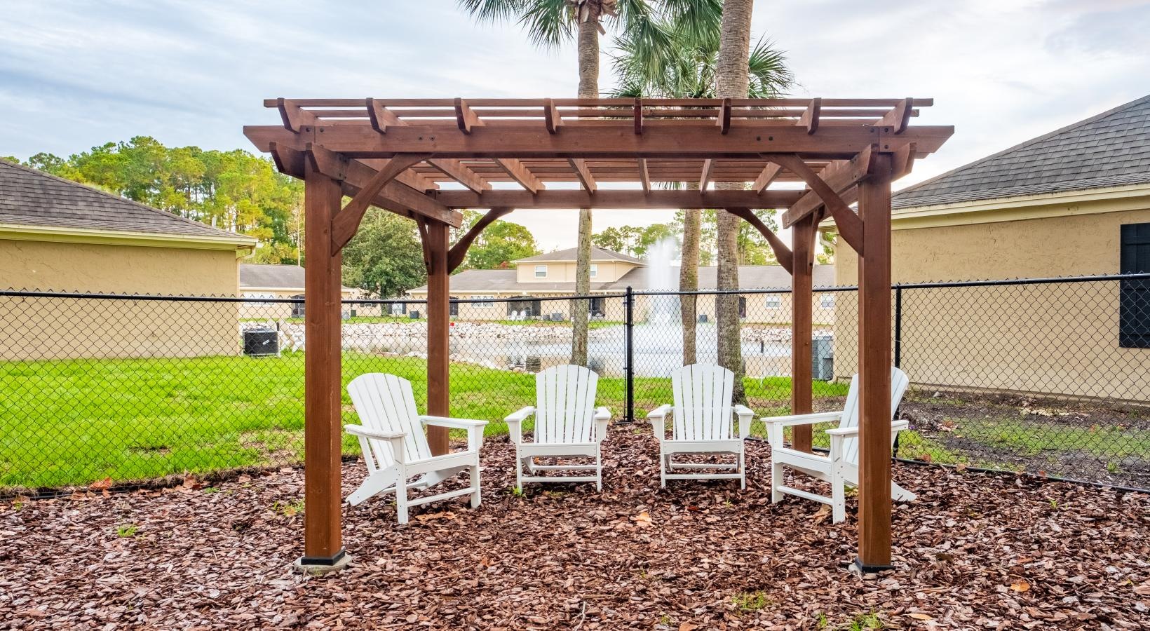 Find your perfect fit at Pickwick Flats a gazebo with chairs and a table in front of it