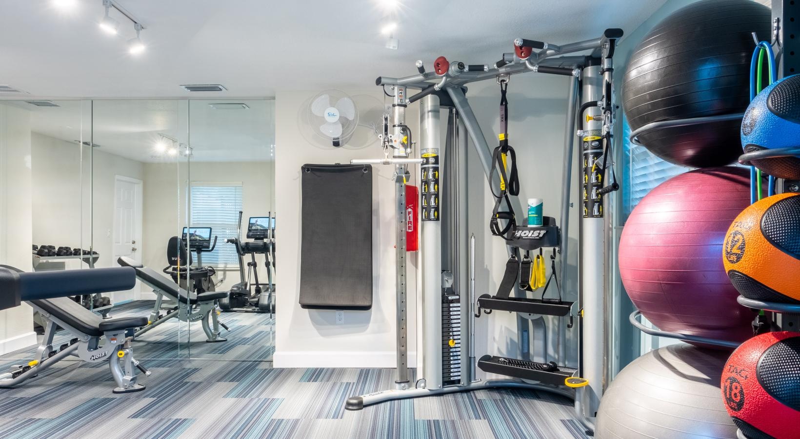 Quick access to state-of-the-art amenities a gym with exercise equipment