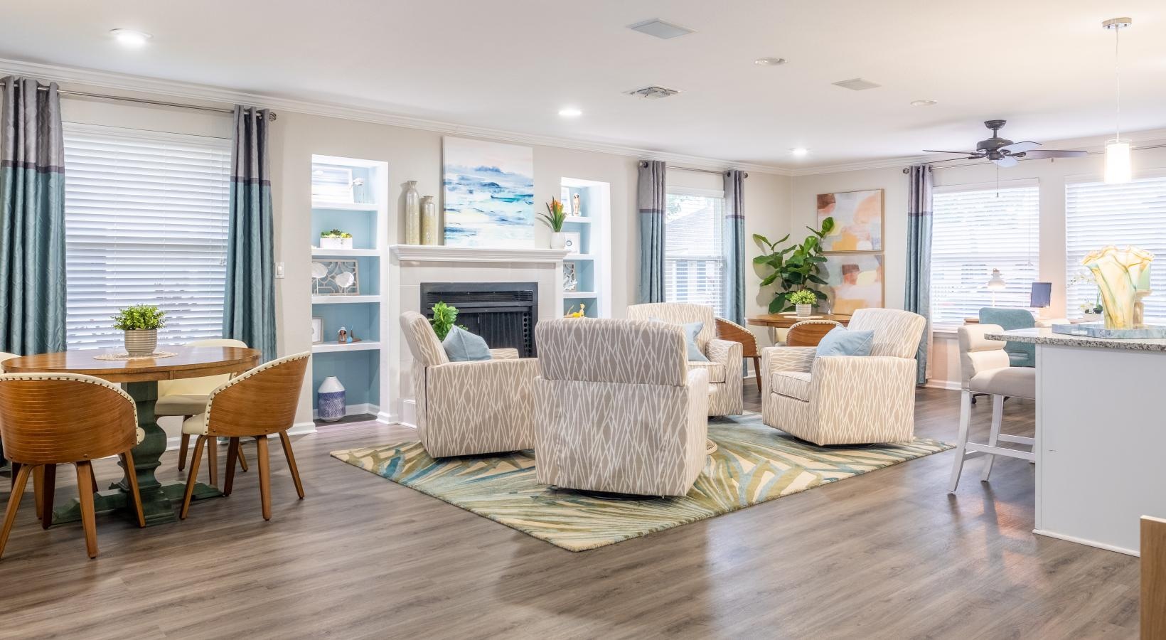 Settle into comfort at Pickwick Flats a large room with a fireplace and chairs