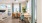 a room with a table chairs and a fan