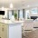 a kitchen with a bar and chairs