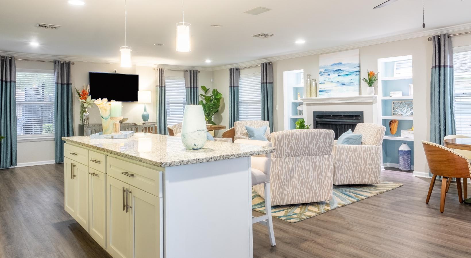 Settle into comfort at Pickwick Flats a kitchen with a bar and chairs