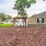 a dirt yard with a gazebo